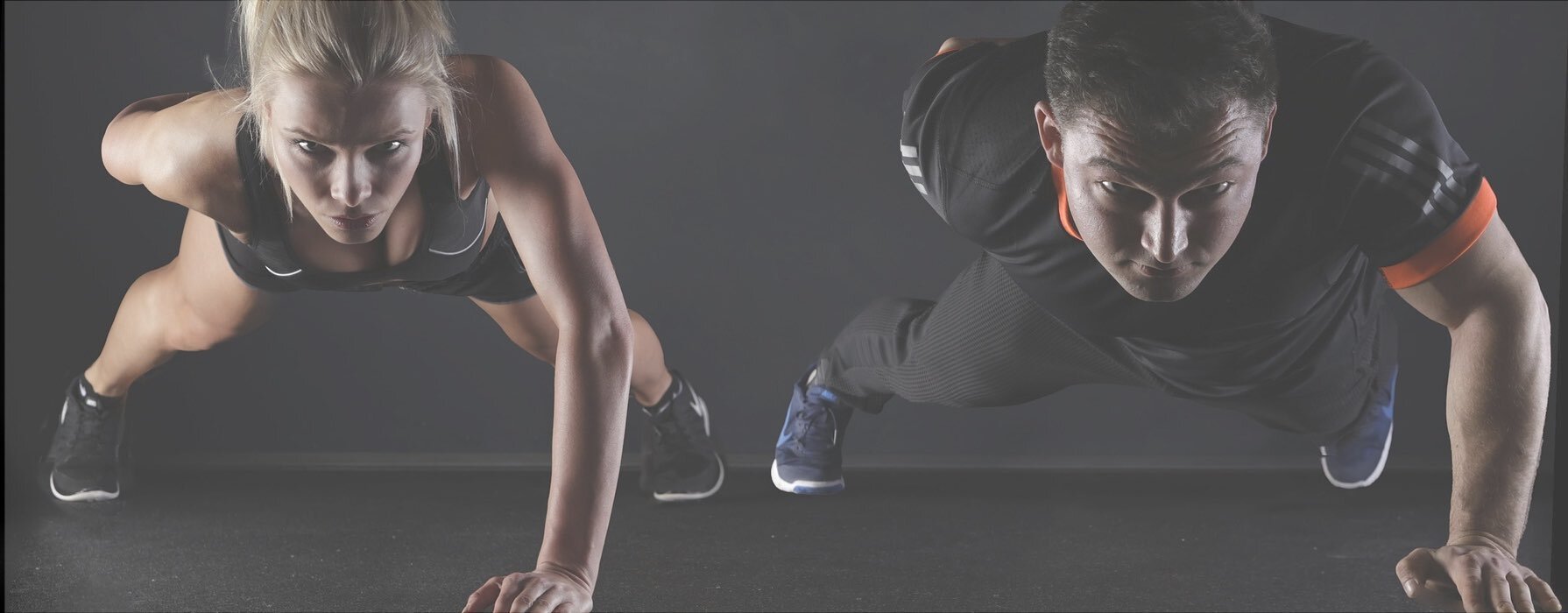 woman and man doing one handed push-ups
